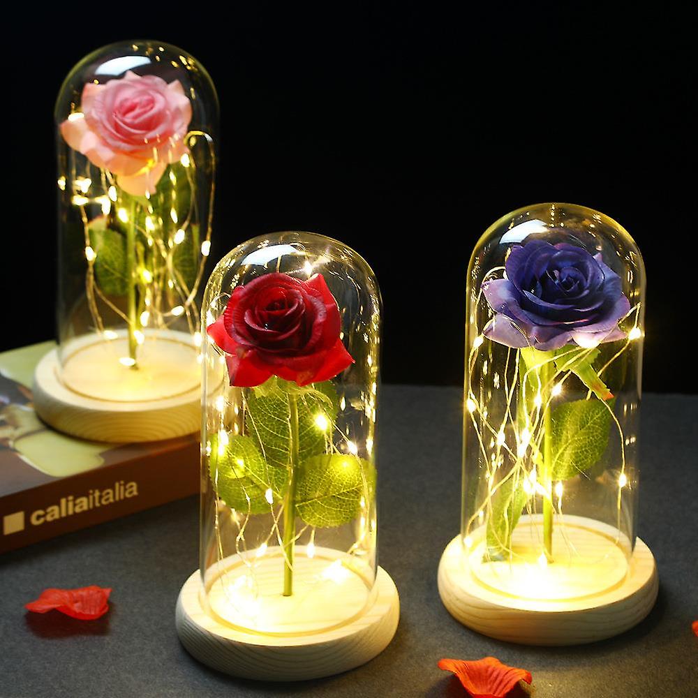 a couple of glass vases sitting on top of a table 