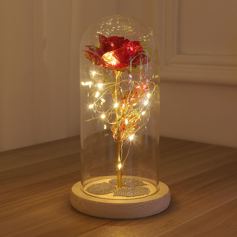 a glass vase sitting on top of a table 